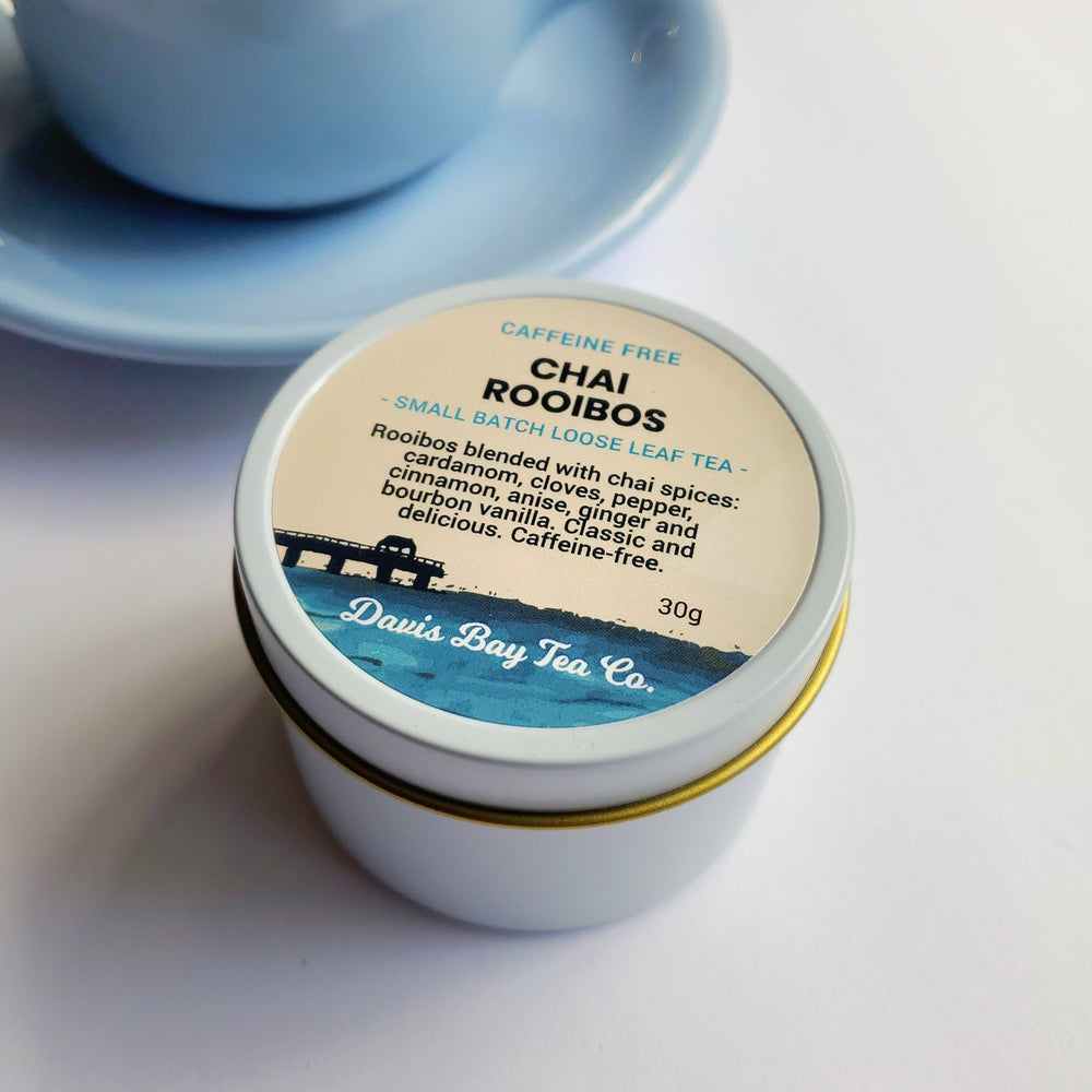 
                  
                    Tea canister with 'Chai Rooibos' label on a white background
                  
                