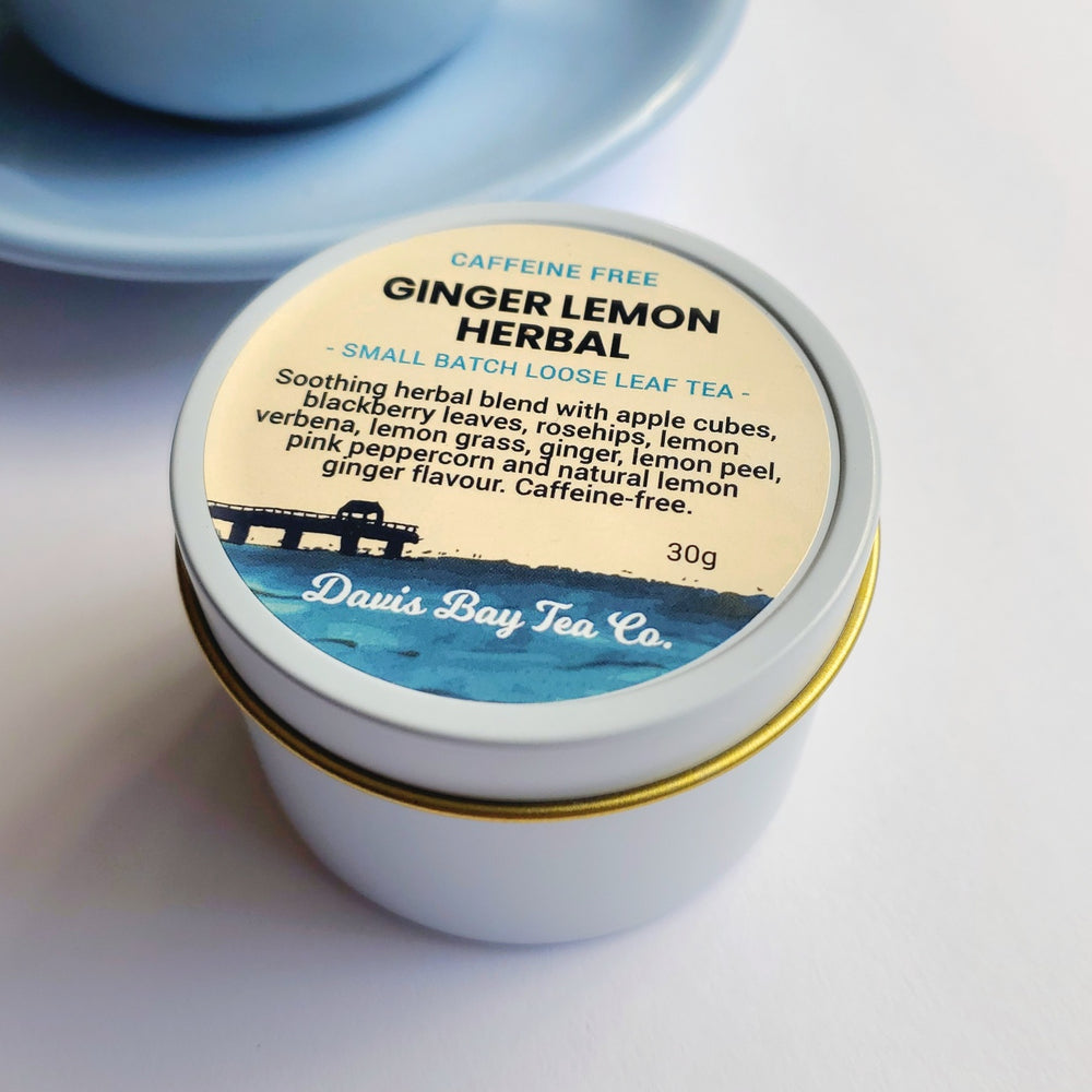 
                  
                    Ginger Lemon Herbal tea canister with label on a light background
                  
                