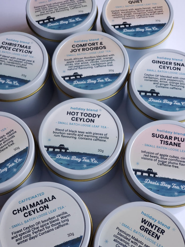 Collection of 30g holiday tea tins from Davis Bay Tea Co. with various tea types on labels.
