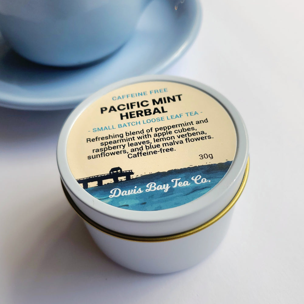 
                  
                    Tin of Pacific Mint Herbal tea with a scenic label on a white background
                  
                