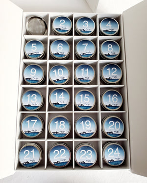 
                  
                    tea advent box with all tea tins exposed from drawers 
                  
                